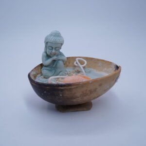 A Small Statue or Representation of Buddha Often Associated with Koi Fish Likely Designed Aesthetic Candle