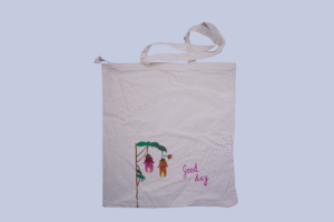 A white cotton tote bag with a beautiful greetings of good day
