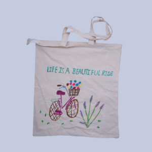 A white cotton tote bag with life is a beautiful ride